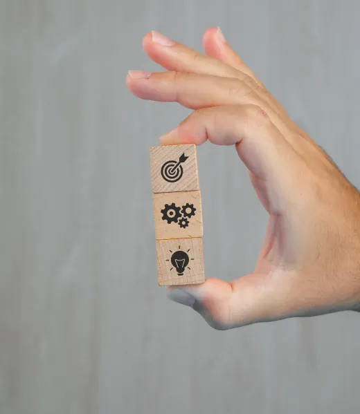 business-concept-grey-table-side-view-hand-holding-wooden-cubes-with-icons